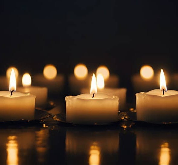 Dimly lit room with 3 small candles