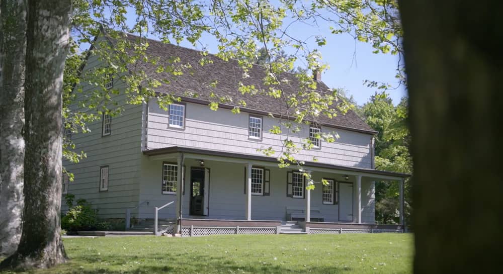 Quaker Meeting House with blurred trees in foreground
